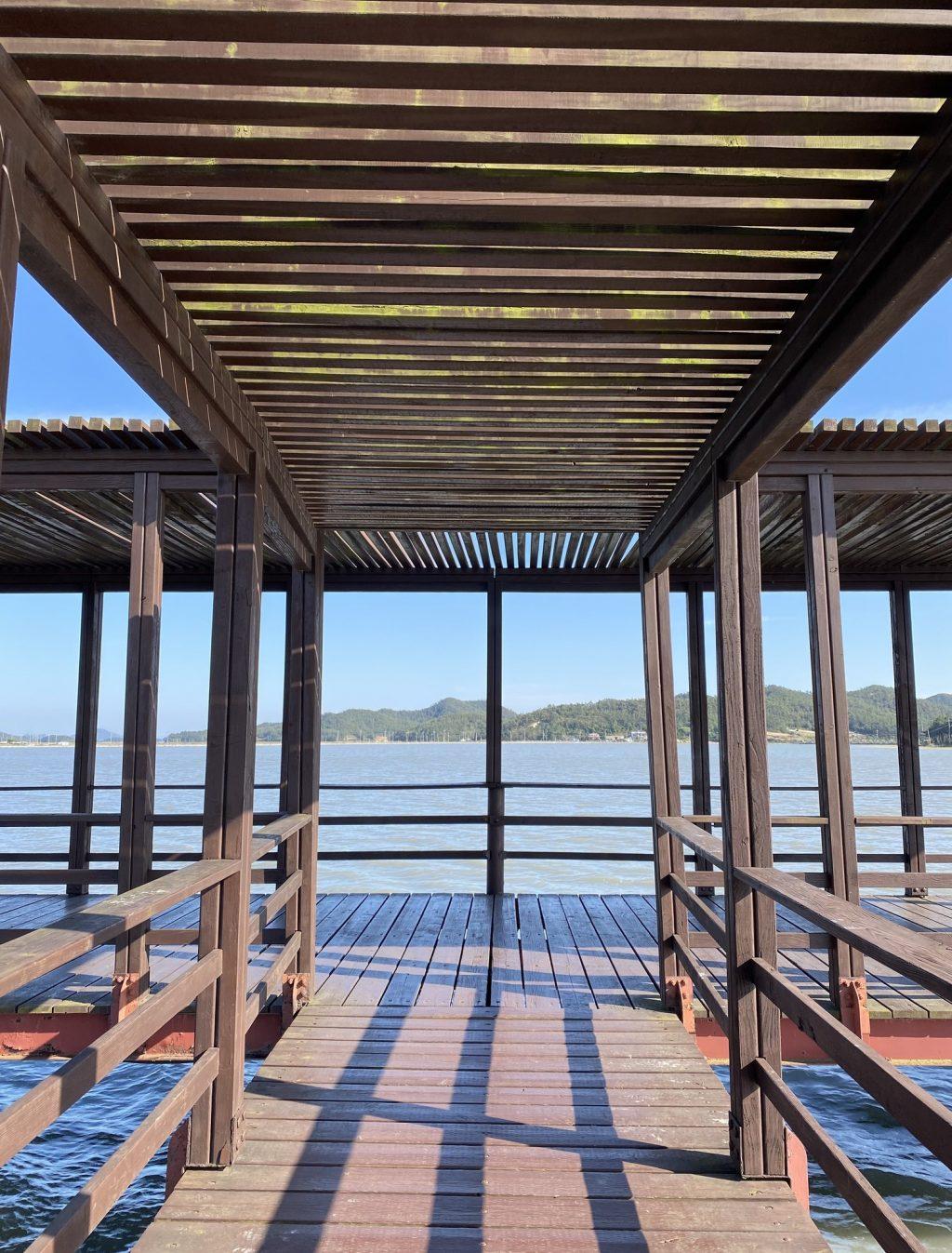 A wooden bridge stands above a mudflat on the island of Jeungdo on Oct. 18. I met many foreign exchange students through a tour group that took us along the Western region of South Korea. Photo by Claire Lee