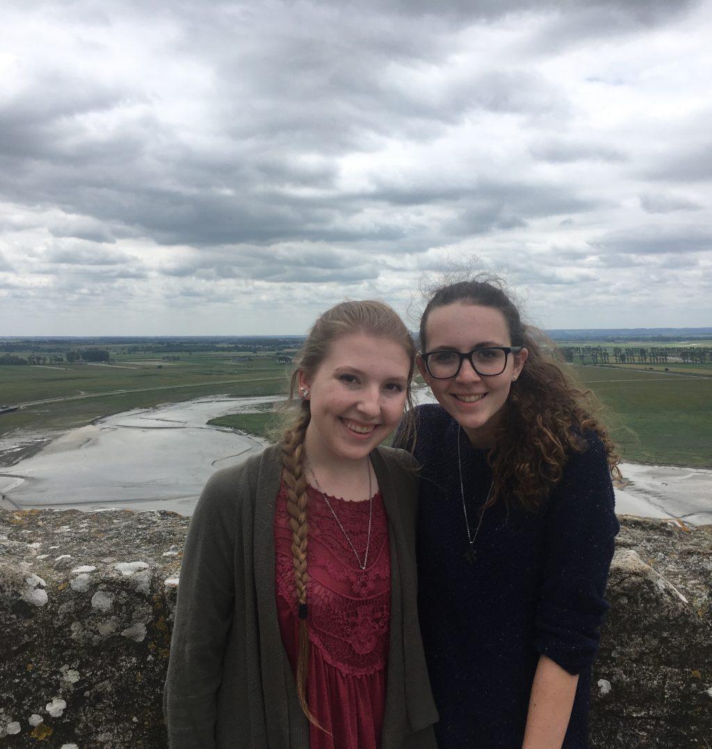 Thompson and Miller pose for a picture in Northern France during their senior trip in 2018. They said they have traveled a lot since. Photo courtesy of Katie Thompson