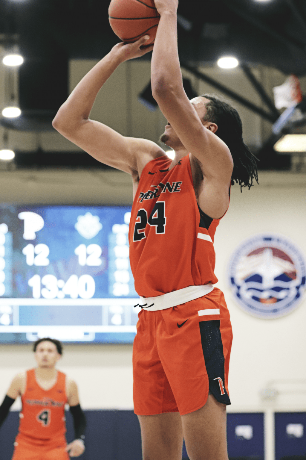 Graduate student forward Kene Chukwuka elevates his shooting platform for a baseline jump shot in the first half versus Portland.