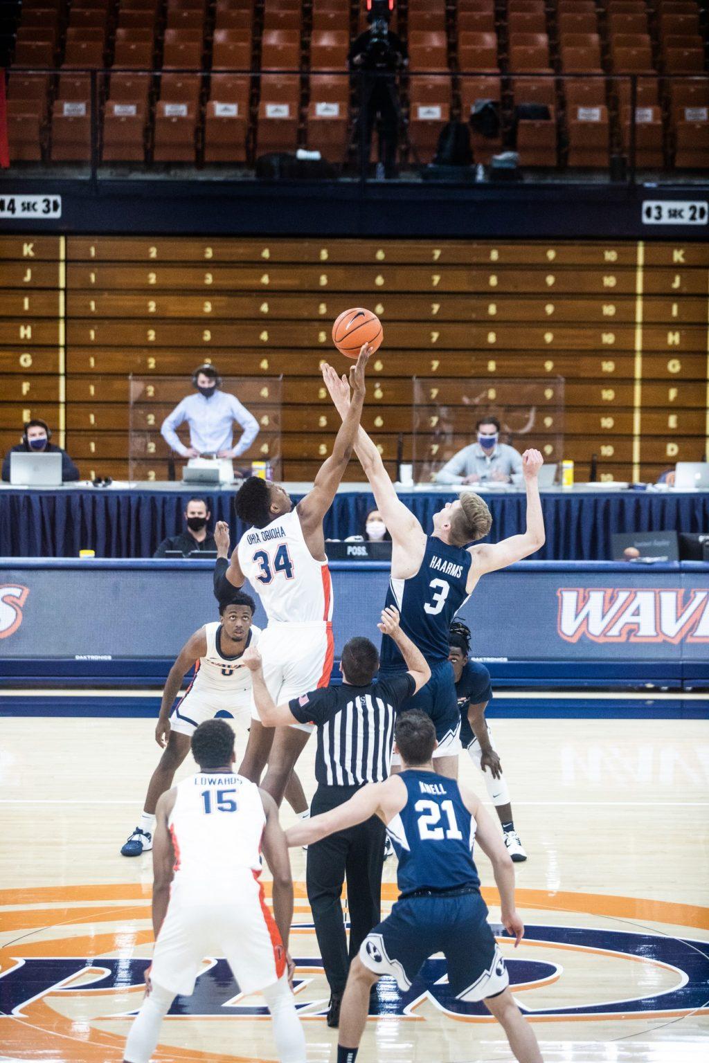 Junior center Victor Ohia Obioha wins the opening tip-off against BYU forward Matt Haarms. Ohia Obioha, who is 6’9”, was one of the many Pepperdine big men who held 7’3” Haarms to only 6 points off 3-10 shooting.