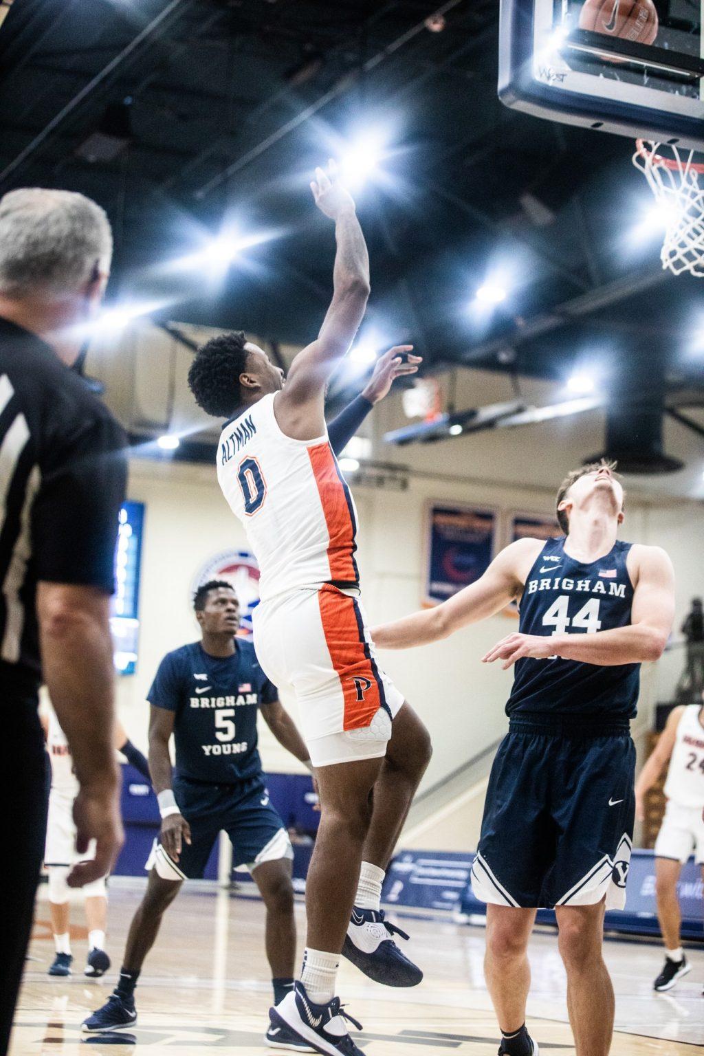 Sophomore guard Sedrick Altman shoots a baseline runner over BYU guard Connor Harding (No. 44). Altman finished with 11 points, 9 rebounds and 2 steals.