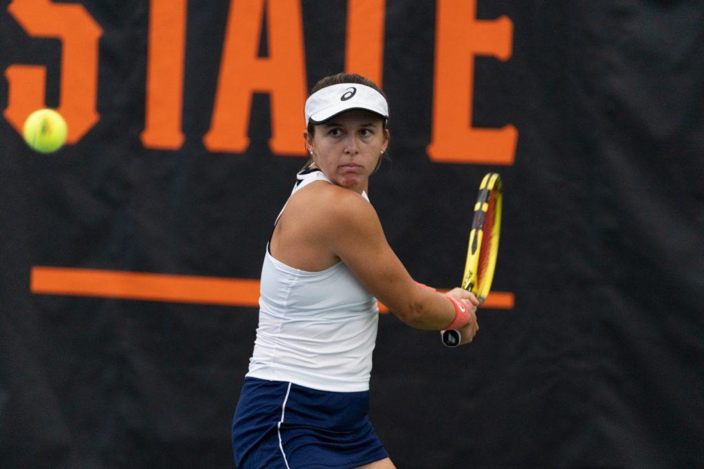 Freshman Nikki Redelijk readies to strike a backhand against Georgia Tech's Rosie Garcia Gross in their singles match Feb. 5 at Oklahoma State University. Redelijk won the match in three sets to clinch the match for Pepperdine.