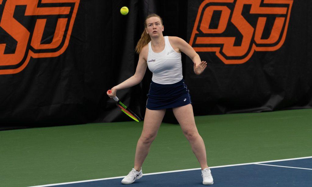 Freshman Taisiya Pachkaleva reaches back to hit a forehand during her singles match against Gia Cohen of Georgia Tech on Feb. 5 in Stillwater, Okla. Pachkaleva lost the match against Cohen but went on to dominate her final two singles matches of the weekend.