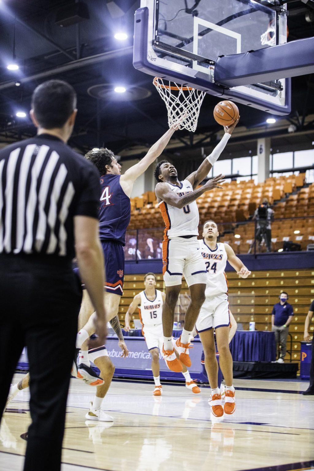Sophomore guard Sedrick Altman finishes a layup with the left-hand. While he had nine points, his biggest impact was on defense with two steals and two blocks.