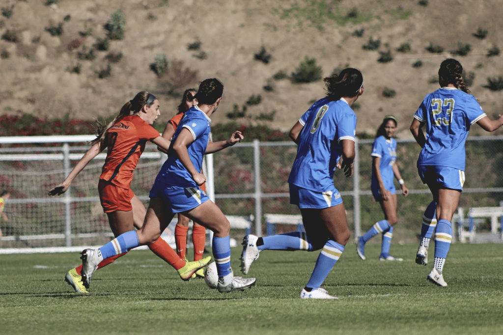 Senior midfielder Joelle Anderson (No. 9) attacks the UCLA defense in the Waves' season opener at Tari Frahm Rokus Field on Feb. 7. Anderson was recently drafted by the Houston Dash in the NWSL Draft.