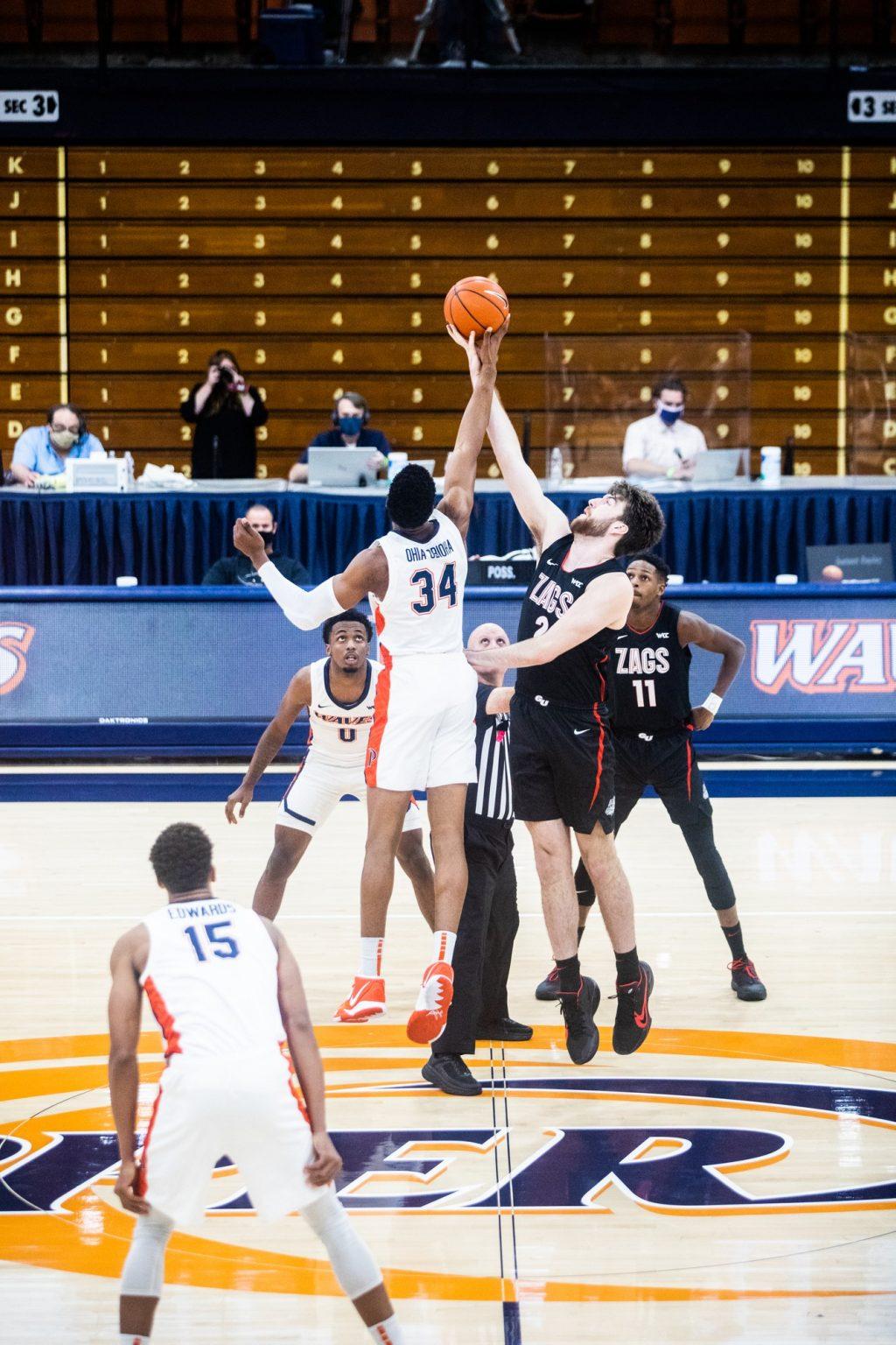 Junior center Victor Ohia Obioha wins the tipoff against Gonzaga's Drew Timme at the beginning of Saturday's game in Firestone Fieldhouse. Pepperdine got off to a hot start in the game, leading 16-7 after the first five minutes.