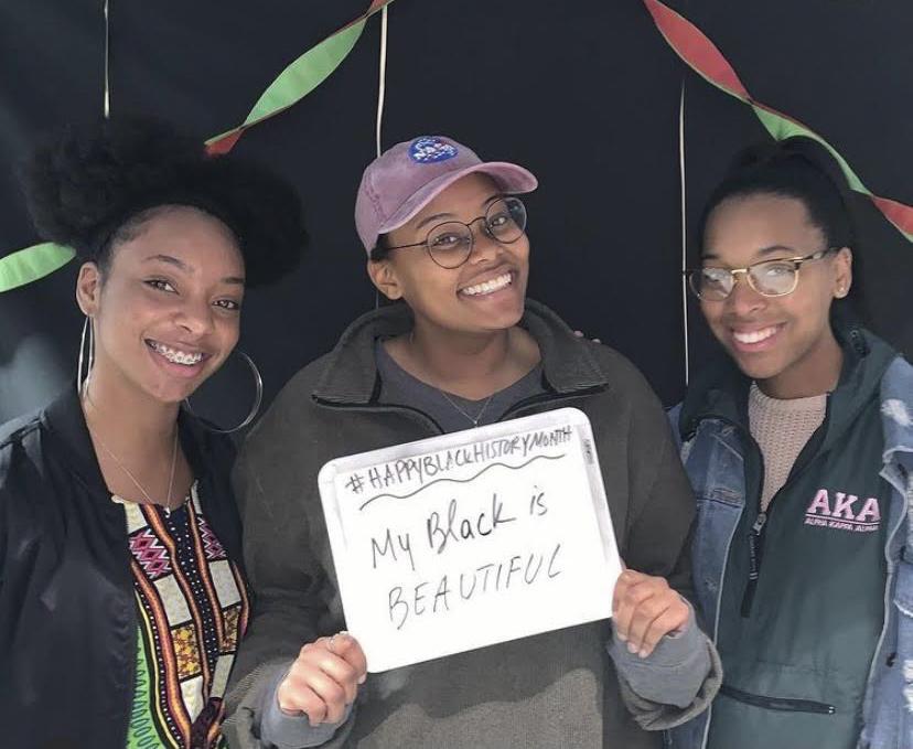 BSA alumni Shanelle Wilkins, Kamryn Calhoun and Geonnie Wilson smile in the photo booth at the end of Black History Month in February 2019 after their talent show event. Students were able to sing, read poetry, play instruments and more.