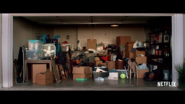 An average American garage is shown while Millburn explains it is the most cluttered part of a house. Millburn continued to build his point by listing out all possible categories of items in each box.