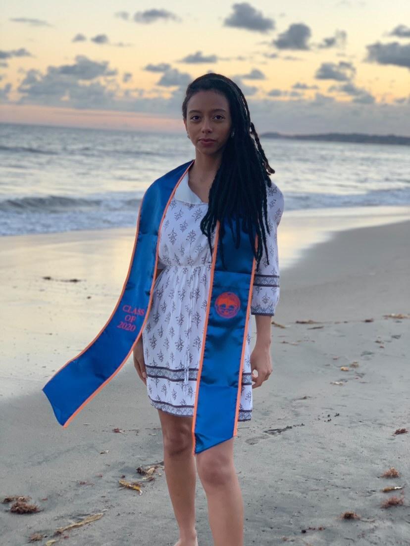Pepperdine alum Olivia Robinson poses on the beach in Malibu to celebrate her spring 2020 graduation. Robinson said she began working on her app, BlackDollar, during her last semester at Pepperdine before officially launching it the following November. Photo courtesy of Olivia Robinson