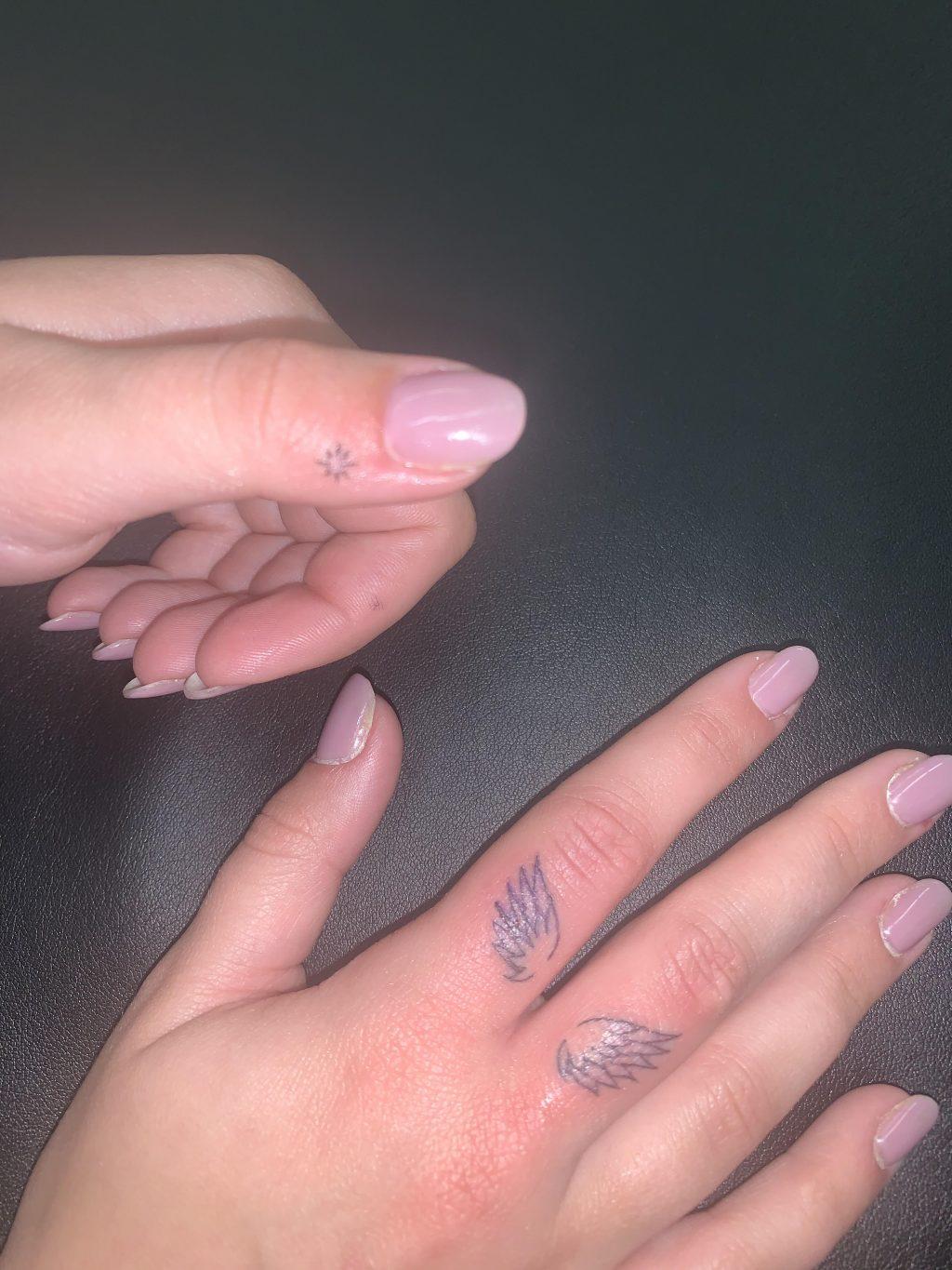 Moore shows off the finished result of her finger tattoo appointment in January 2020. Moore said she reads Yelp and Google Reviews before every new tattoo parlor she visits. Photo courtesy of Marissa Moore