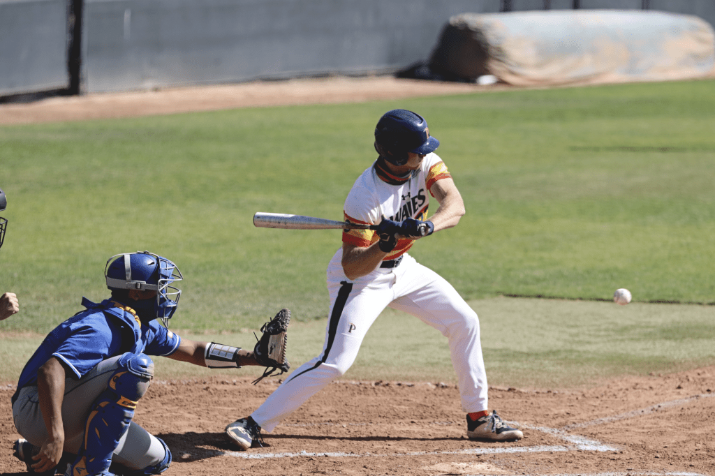 Senior outfielder Billy Cook swings at a first-inning pitch during Sunday's game. On Saturday, Cook's first hit of the season was a grand slam that briefly gave Pepperdine the lead.