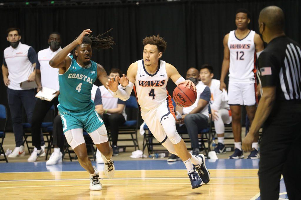 Senior point guard Colbey Ross dribbles the baseline during the CBI championship game versus CCU on March 24. In his final game as a Wave, Ross finished with 15 points and 7 assists.