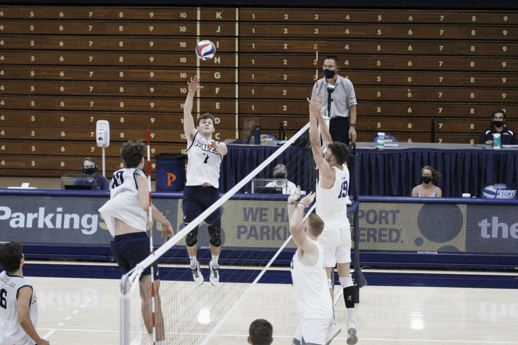 Senior outside Spencer Wickens tips the ball to score a point during the third set against GCU on March 28. Wickens was a top scorer with 14 kills for the Waves against GCU in three matches.
