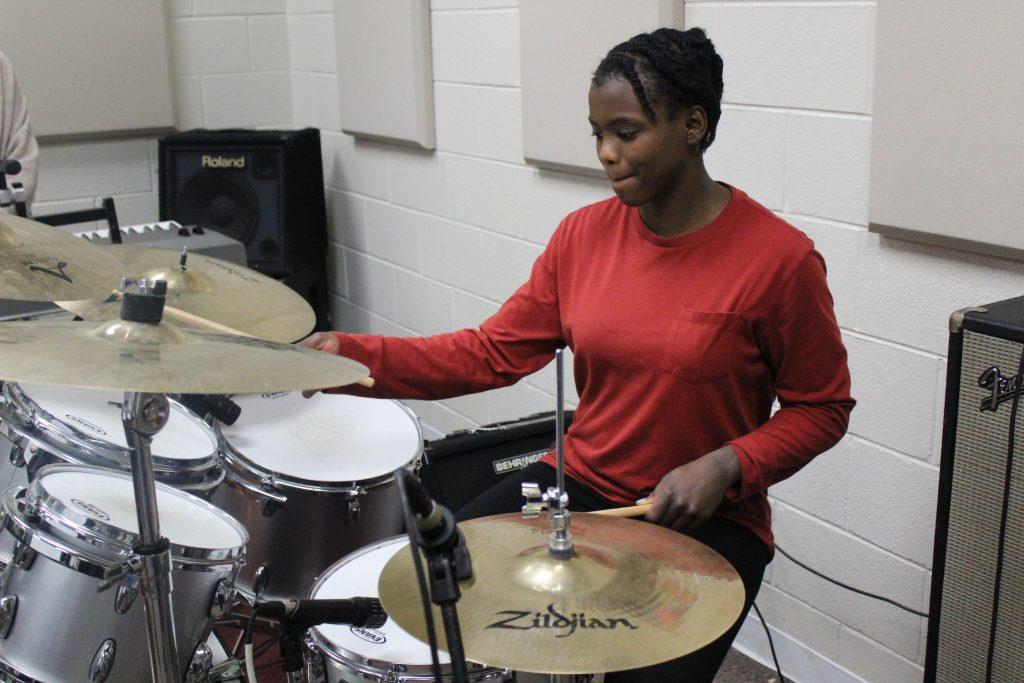 Ferrari plays the drums in the music room at her high school in Birmingham, Ala., in January 2019. About a year later, Ferrari said she released her first single on Spotify called "Don&squot;t Let It Fall Don&squot;t Let It Break."