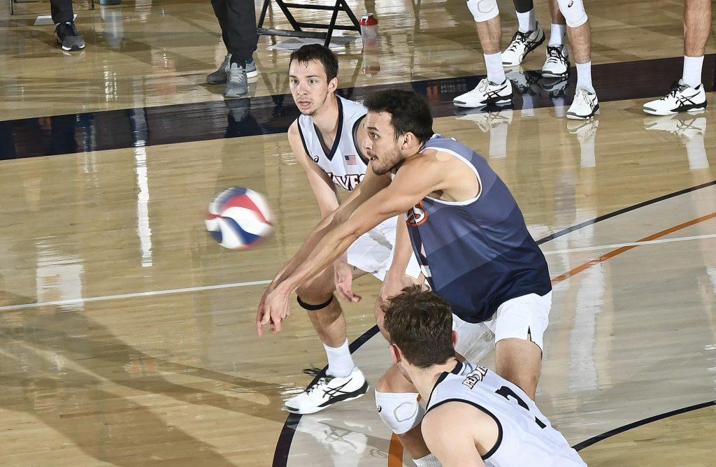 Redshirt senior Noah Dyer passes a BYU serve during Friday's match as senior teammates Alex Gettinger (background) and Spencer Wickens (foreground) look on. The Waves conceded 10 service aces in Friday's loss but only 2 in Saturday's loss. Photo Courtesy of Martin A. Folb | Pepperdine Athletics