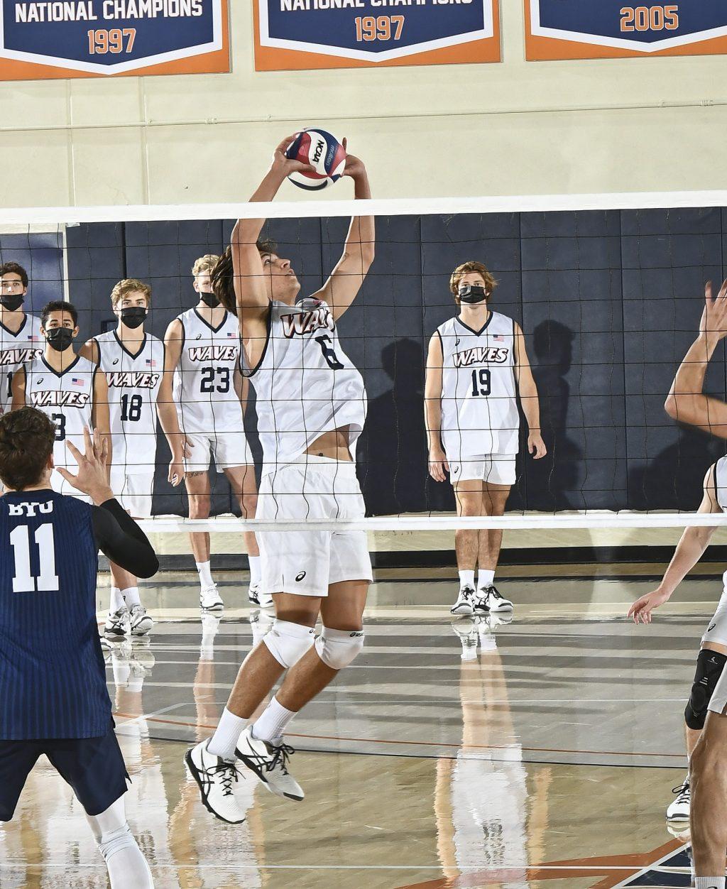 Freshman setter Bryce Dvorak delivers a set to a Waves teammate Friday. Dvorak finished with 33 assists and 6 digs in a four-set loss. Photo courtesy of Martin A. Folb | Pepperdine Athletics