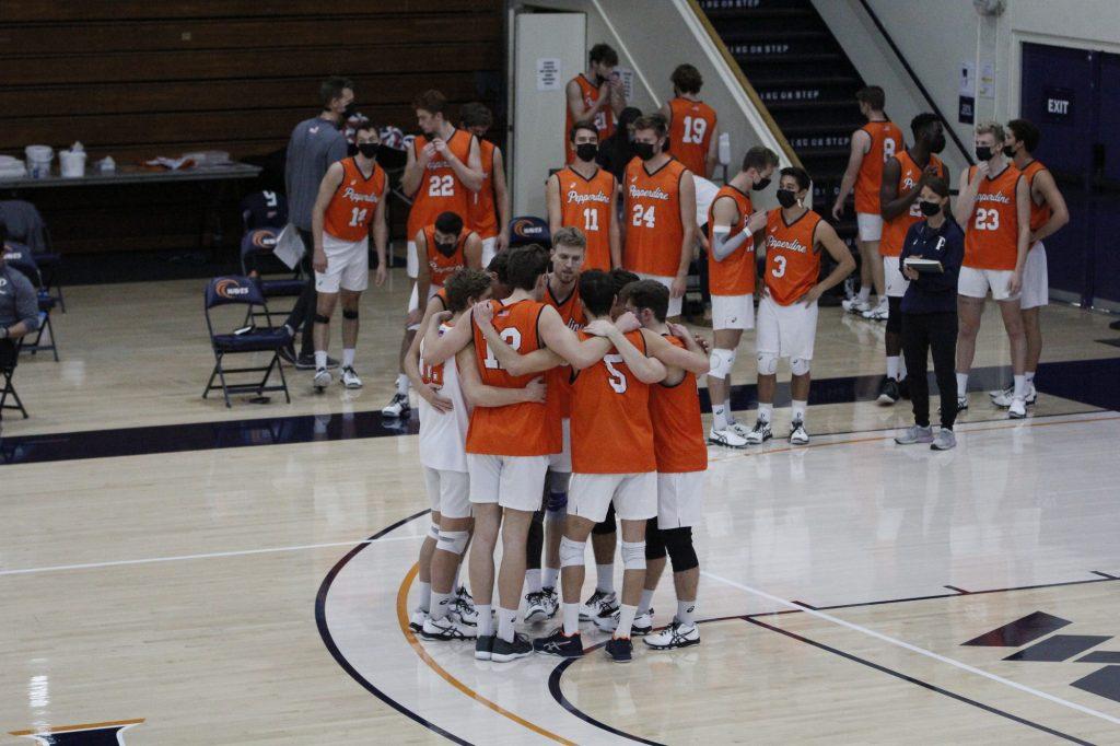 Pepperdine Men's Volleyball huddles to regroup after losing the first set to BYU on Saturday at Firestone Fieldhouse. The team fell in two matches against the Cougars on March 19 and 20, and will now prepare for three weekend matches against Grand Canyon University.