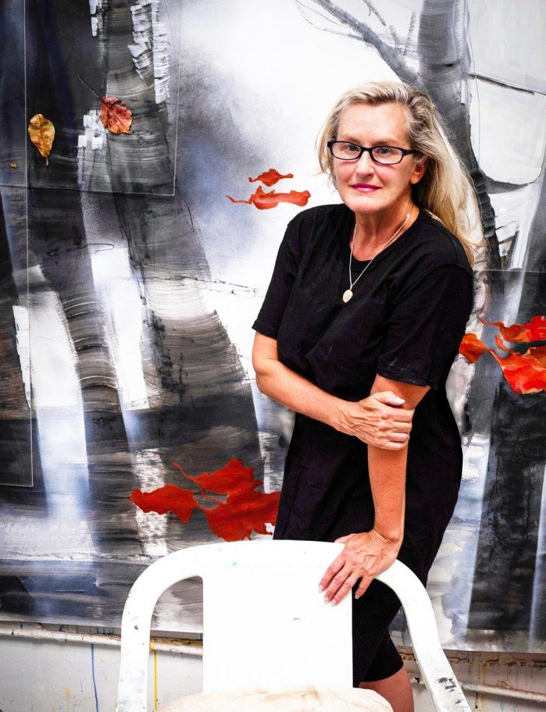 Yvette Gellis poses in front of her abstract art piece. Gellis has been an adjunct professor in the Art Department at Pepperdine since 2014. Photo Courtesy of yvettegellis.com