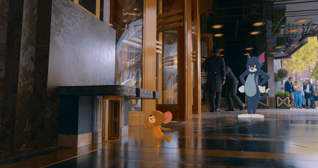 Tom watches as Jerry exits the Royal Gate hotel through his own personal revolving door. This was one of the few scenes in the movie that showcased their traditional dynamic from the cartoon.
