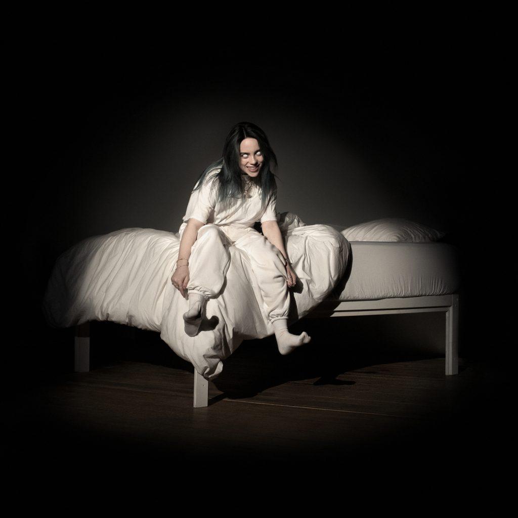 Billie Eilish sits on a bed for her March 29, 2019 album, "When we all fall asleep, where do we go?" cover. Eilish broke the record for being the youngest solo artist to win Album of the Year in January 2020. Photo courtesy of billieeilish.com