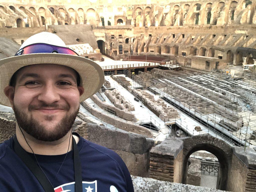 Piccuito smiles while wearing a New England Patriots shirt inside the Colosseum in Rome, Italy while on vacation in 2019. Piccuito said he is a lifelong fan of the Patriots, and football is his favorite sport.