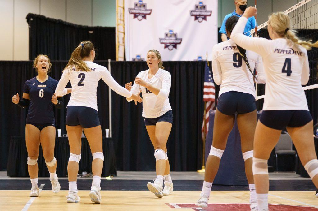 The Waves celebrate a point during their first-round victory against UMBC at the NCAA Tournament. The Waves dominated the first set of the match 25-7 and went on to take the final two sets 25-22 and 26-24.