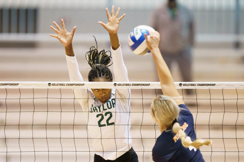 Pepperdine sophomore outside hitter Kayleigh Hames directs a hit against the block of Baylor's Yossiana Pressley in the second round of the NCAA Tournament on April 15 in Omaha, Neb., Hames finished with 7 kills and 5 digs in the match.
