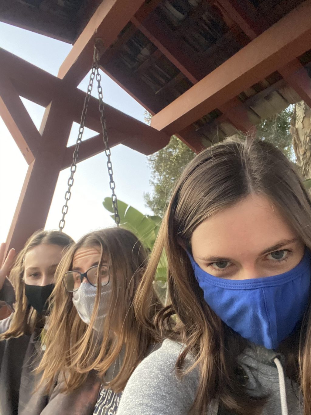 Ashley Mowreader, Haley Brouwer and Alaina Housley pose on the DTR bench fall 2018 (above) and years later, Mowreader and Brouwer returned to the bench with Pari Cribbins fall 2020 (below). The DTR bench can be used by friends and lovers alike. Photos by Ashley Mowreader