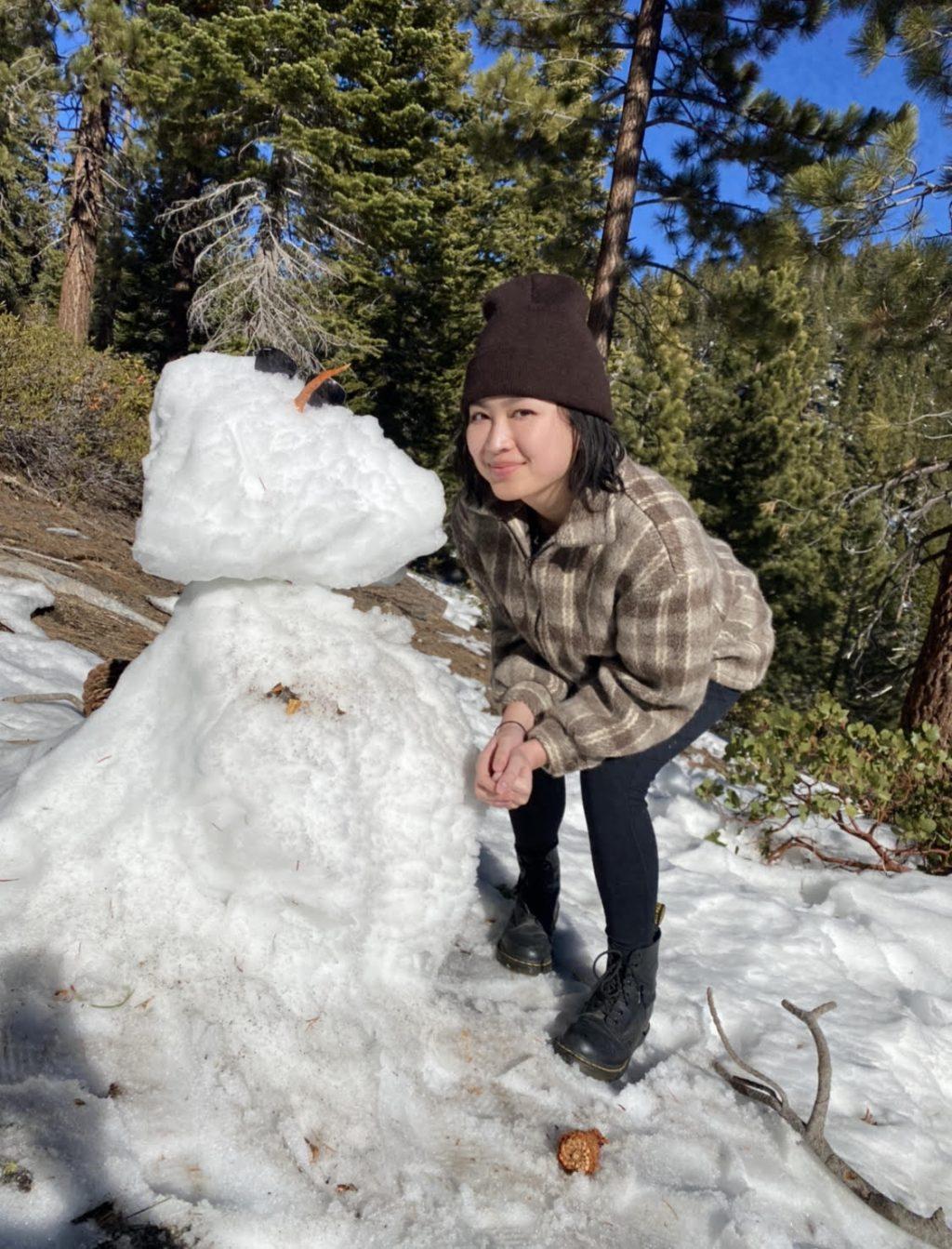Chan poses with a snowman she found while hiking in Lake Tahoe, Calif., in January. Chan said she wanted to make the move from Northern California to Southern California for a chance to enjoy warmer weather.