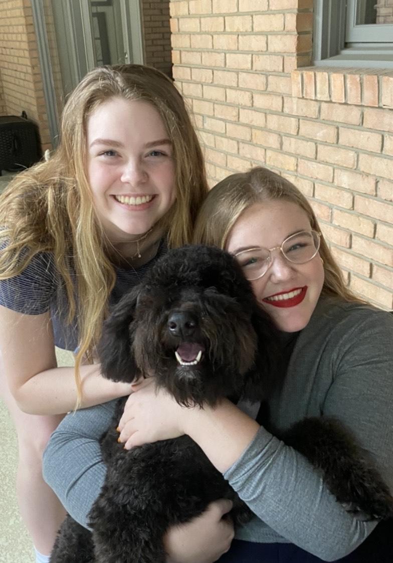 Duvall and her sister Madeline pose with their dog Ripley in Texas, in May. Duvall said she lives with her sister in a Drescher apartment.