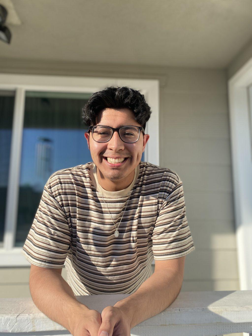 Barragán leans over the railing of his front porch in Hawthorne for a RISE Instagram post in January. He said RISE has been a great program to be a part of and something that he is looking forward to continue in person.