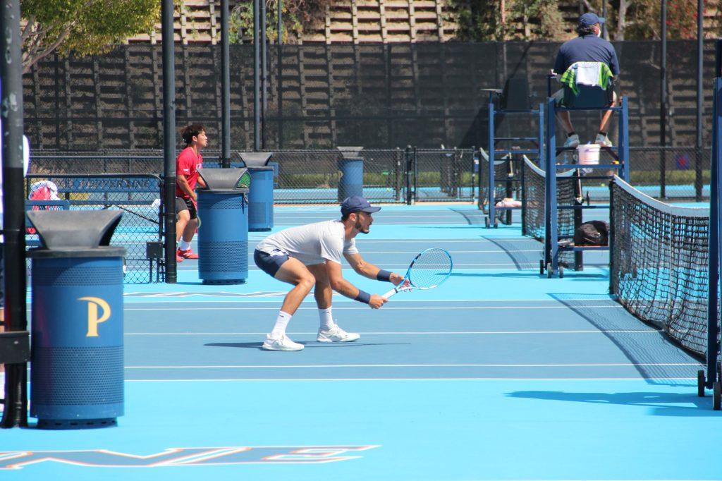 Junior Corrado Summaria prepares for the opposing team's serve April 11, at Pepperdine University. Summaria was solid against the Lions, winning 6-2, 6-3.