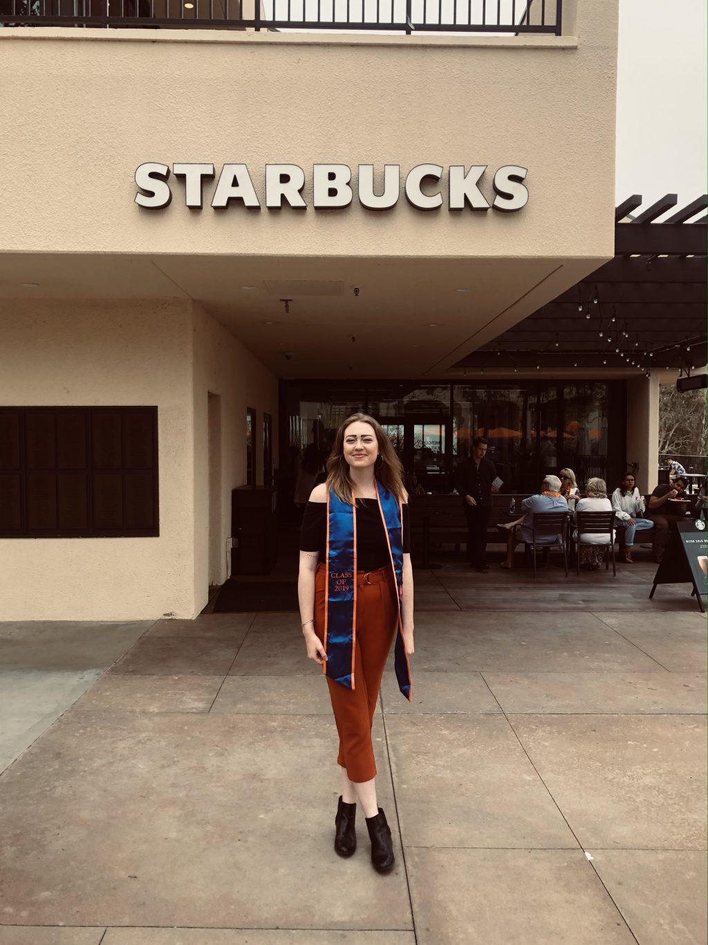 Donlon smiles outside of the Malibu campus Starbucks at the end of her final semester at Pepperdine in spring 2019. Donlon said she thinks it is funny that so much of her life involves coffee, between her work with Coffee Monday and her job as a Starbucks barista.
