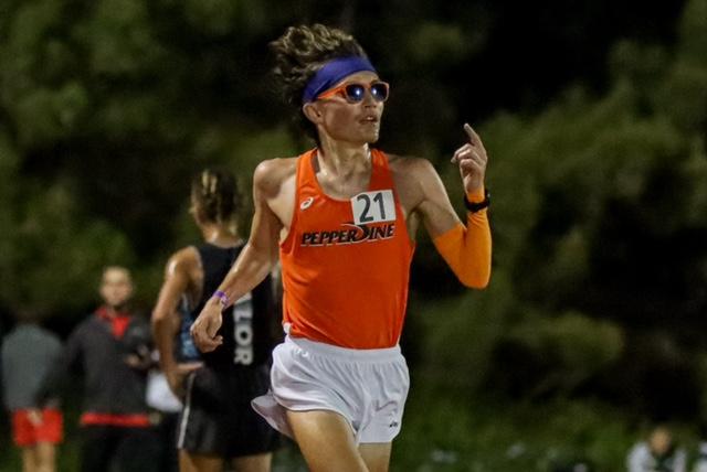 Junior Kyle McCabe, a Pepperdine Graphic Assistant News Editor, keeps his 73-second per-lap pace in the 10,000-meter April 17. McCabe shattered the school record by over 27 seconds in his first time in the race.