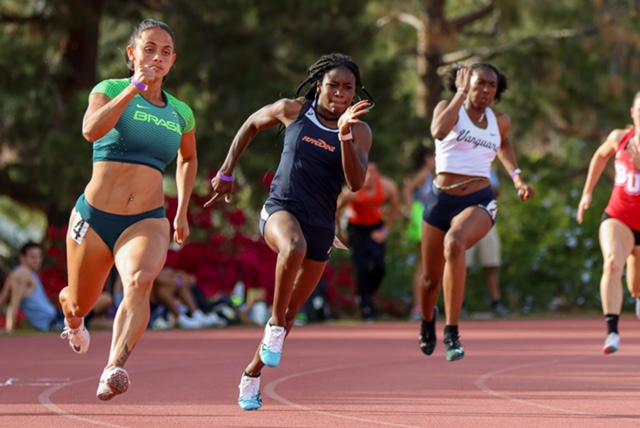 Graduate student Kennedy Kerr makes her way around the turn in the 200-meter dash April 10. Similar to Davis, she broke the school record in the 100-meter dash April 17.