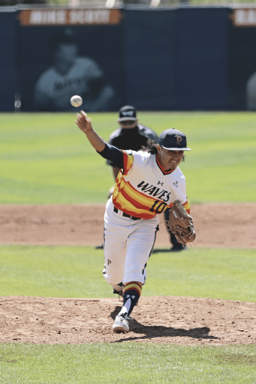 Junior pitcher Trevor Kniskern lofts a pitch against Saint Mary's on March 28. After an earlier positive test knocked them out for one game, the impact of contact tracing forced several games to be postponed this week. Photo by Ali Levens