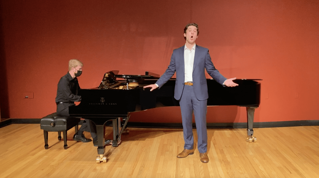 Senior Music major Joe Hebel belts out a note while singing "She Cries" in Raitt Recital Hall on March 9. Hebel said the performances were filmed with a tripod, ring light and the recital hall&squot;s audio equipment. Photo Courtesy of Sydney DeMaria