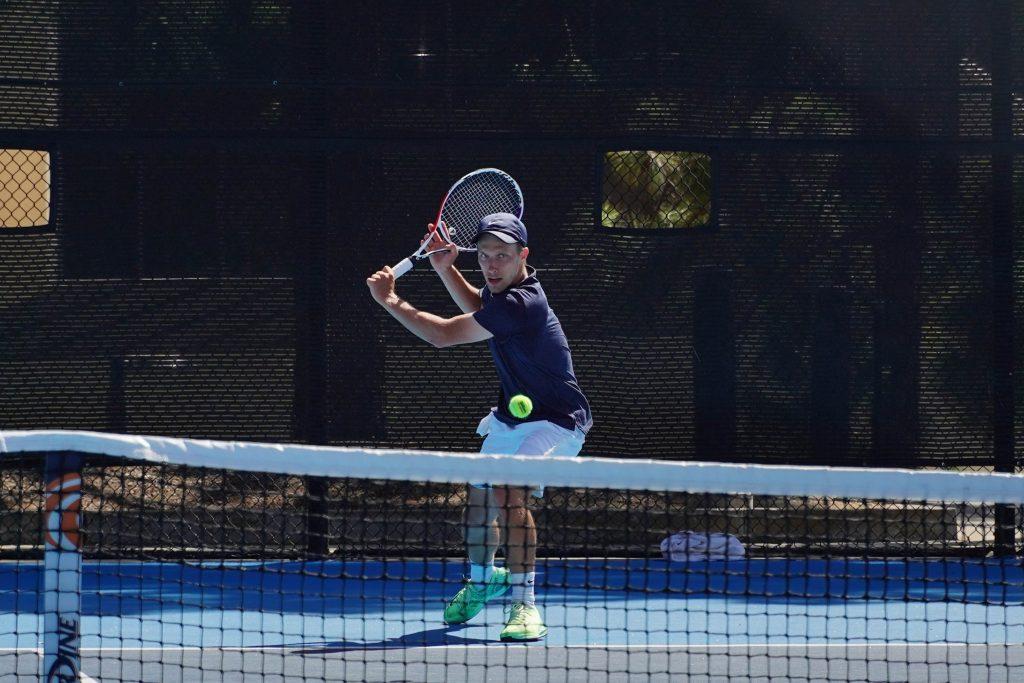 Junior Tim Zeitvogel returns the ball April 11, at Pepperdine. Zeitvogel has battled back from COVID-19 and is returning to top form.