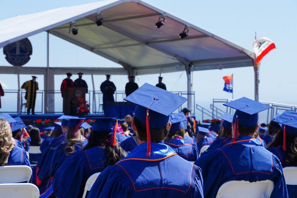 Class of 2020 graduates sit socially distanced on Alumni Park. Pepperdine hosted back-to-back commencements the weekend of May 21-22.