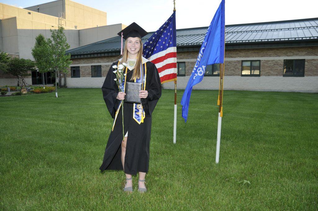 Wideen poses during her drive-in graduation from Sauk Prairie High School in Prairie du Sac, Wis., in May. Wideen said she is excited to live in Malibu.