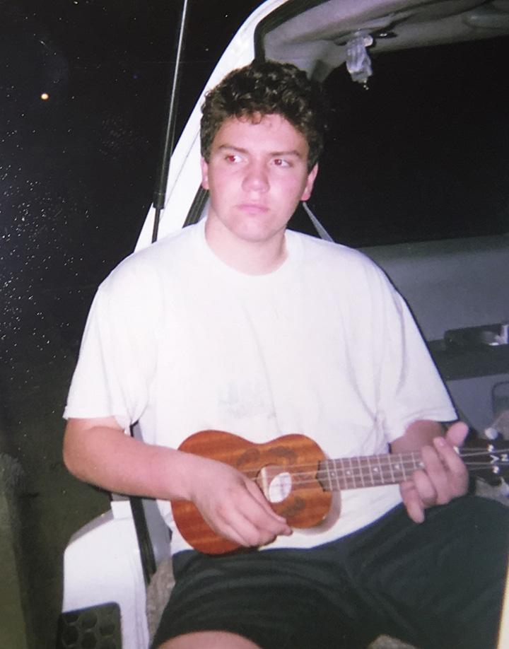 Mathews plays a ukulele in the back of a car during the summer of 2015. Artists like Sufjan Stevens and Phil Elverum inspired Mathews to create authenticity in his own music.