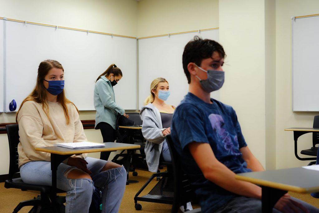 Sophomore Johnathan Flint (right) sits in Professor Matt Micek's Biostatistics class in the Rockwell Academic Center on June 7. The class was Flint's first-ever in-person college class, a year after he enrolled at Pepperdine.