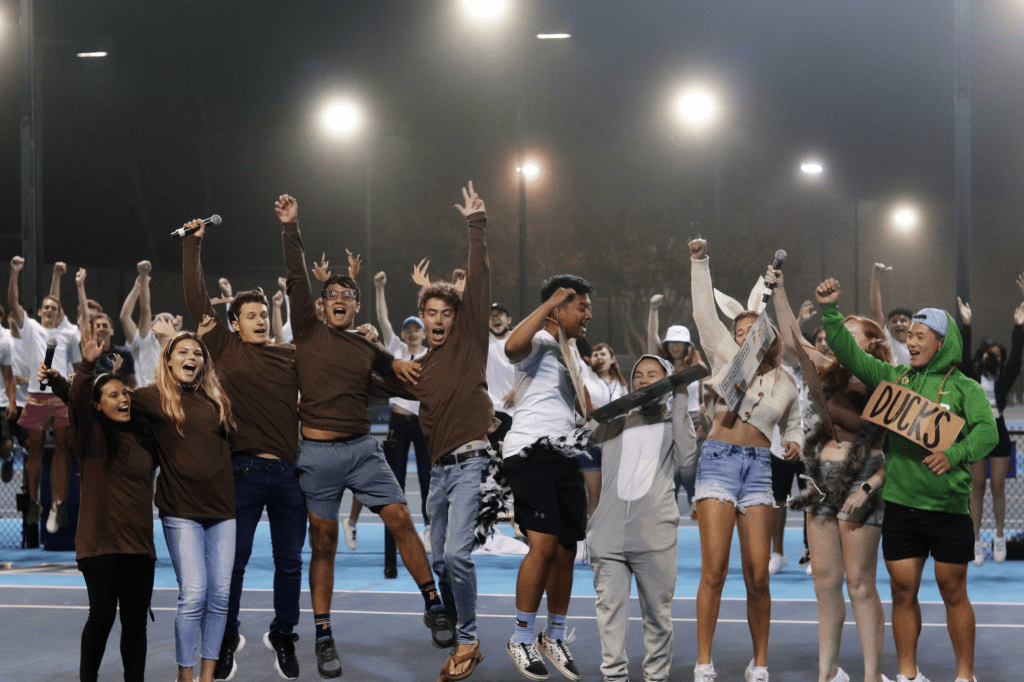 First-years, dressed as Pepperdine deer and other wildlife, jump in glee after agreeing to get along while occupying the Malibu campus at the Ralphs-Straus Tennis Stadium during Frosh Follies on Aug. 28.