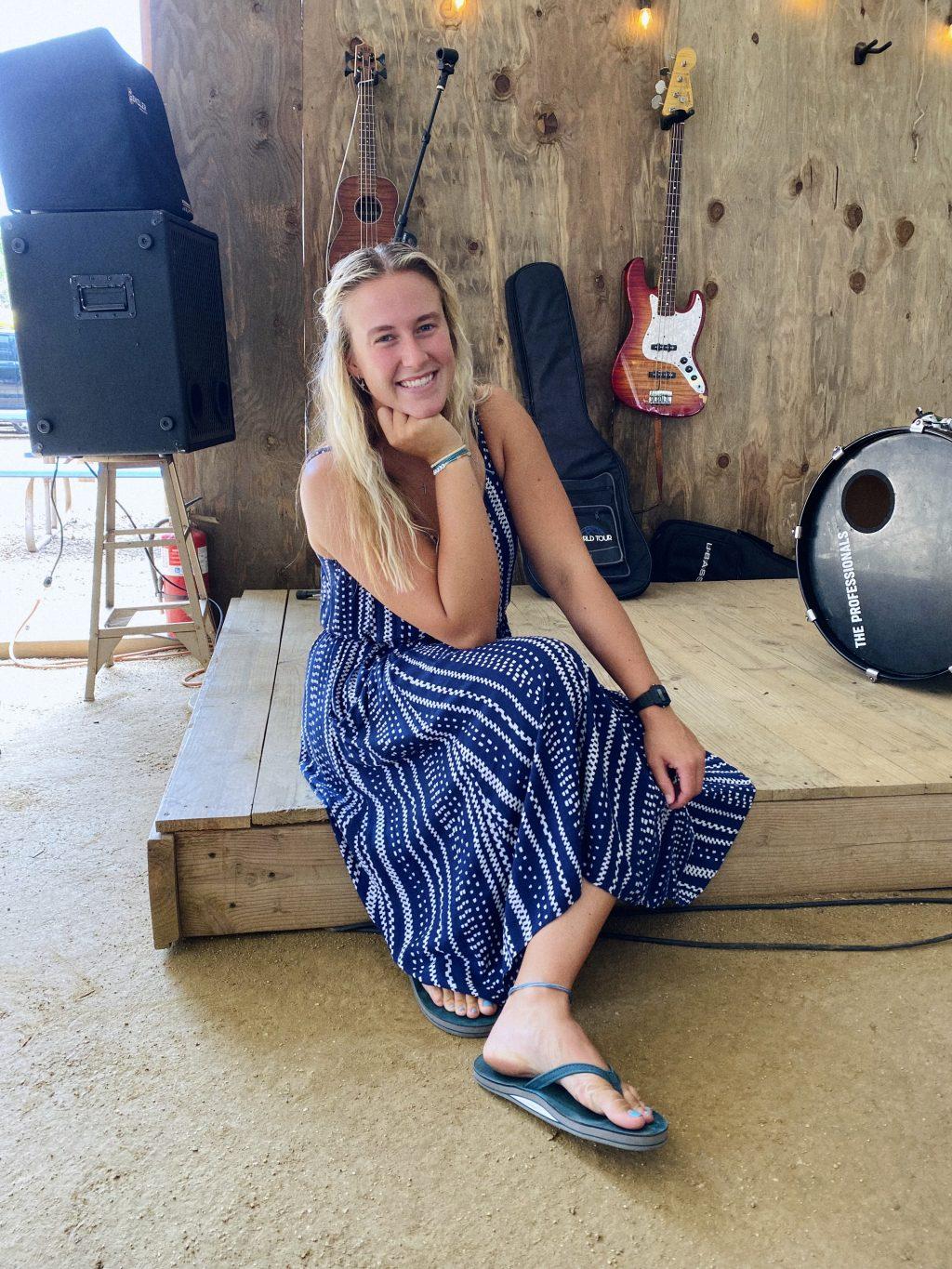 Worship leader and senior Lily Dyer smiles after she hops off stage from a wonderful time of worship and song. Dyer played guitar and led with vocals.