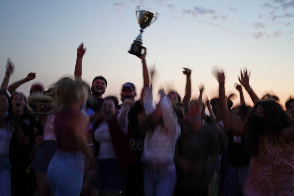 Lausanne program alumni from the 2019-20 academic year celebrate their championship status after winning the tug-o-war. This is the second-consecutive year the Lausanne program has taken home the trophy.