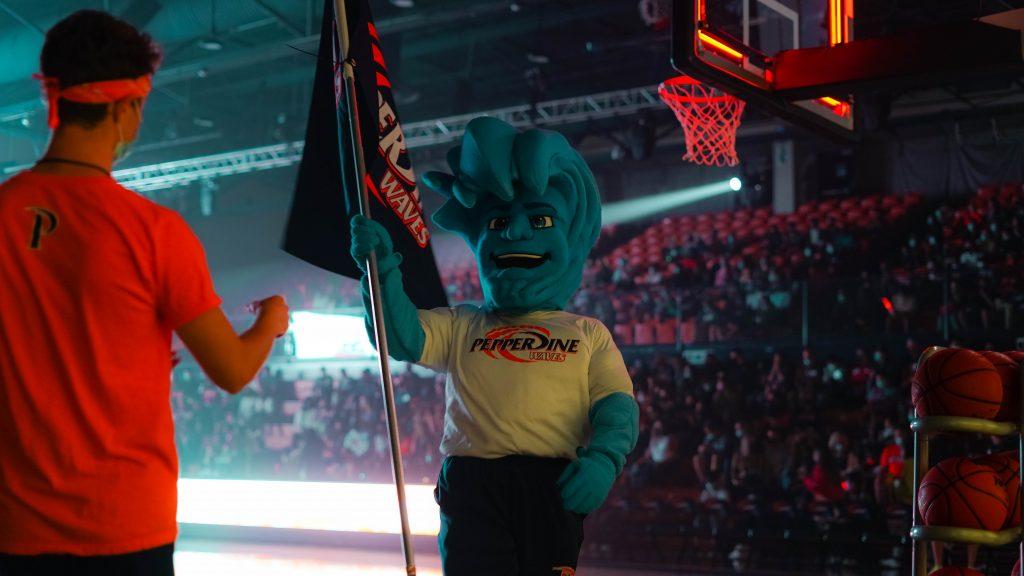 Willie the Wave flies his Pepperdine flag at Blue and Orange Madness. The event took place in Firestone Fieldhouse and was a pep rally to kick off the men's and women's basketball seasons. Photo by Dane Bruhahn