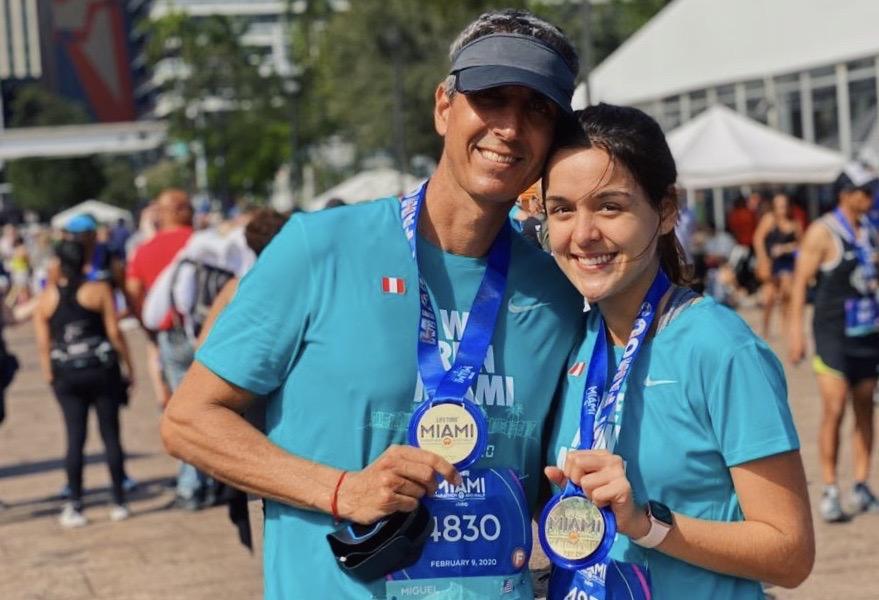 De La Flore and her father pose with their medals after running the Feb. 9, 2021 Miami Marathon. Growing up, De La Flore said her father was an avid marathoner, so when she began to run, their shared interest bonded them.