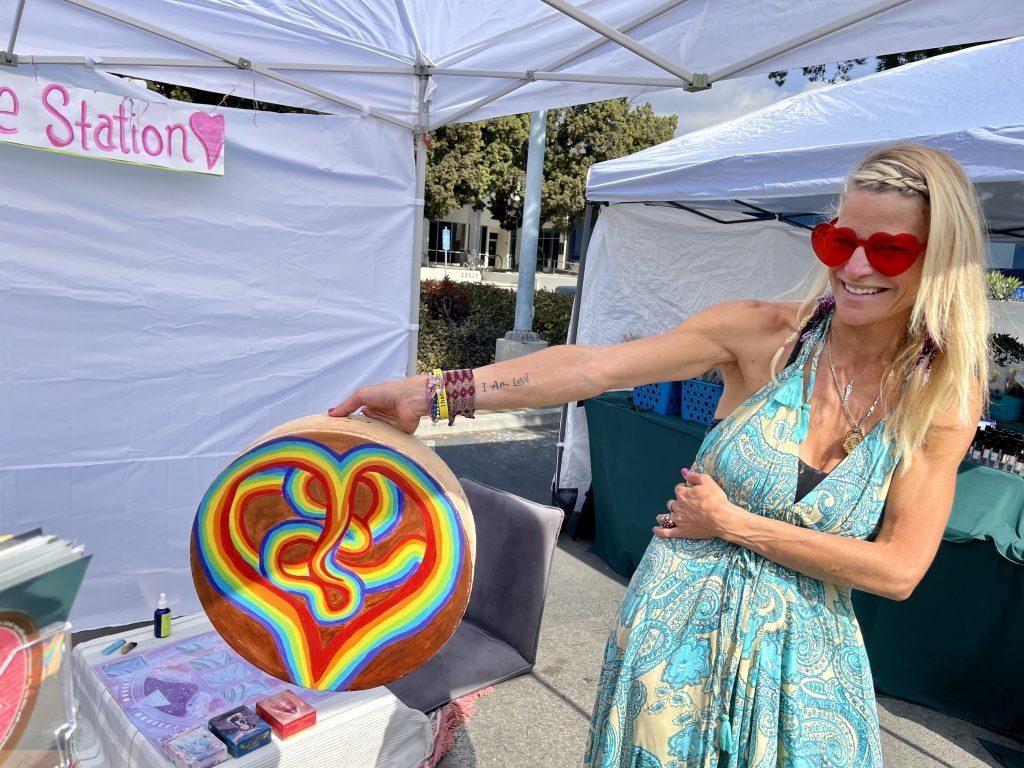 Melissa Eliyahoo shows her "I AM LOVE" tattoo. She said she wanted to remind herself of the importance of looking for love within oneself rather than searching outwardly. Photo by Liza Esquibias