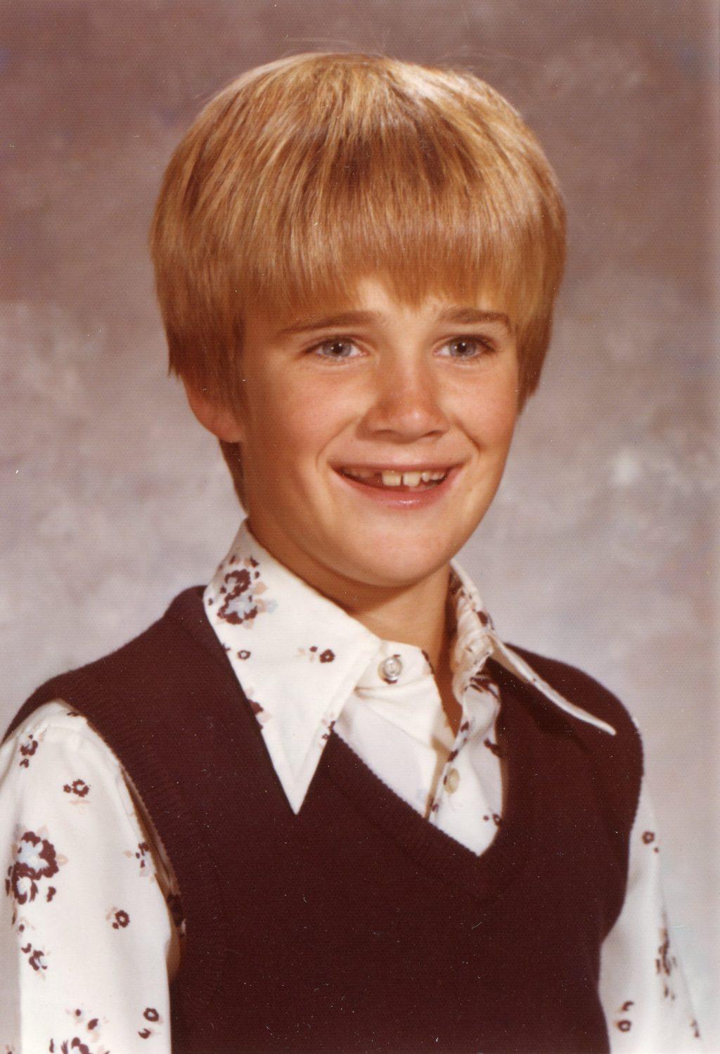 Jim Gash smiles for his fourth-grade school photo. Gash said he lived on a street with other kids whom he often played outside with. Photo courtesy of Jim Gash