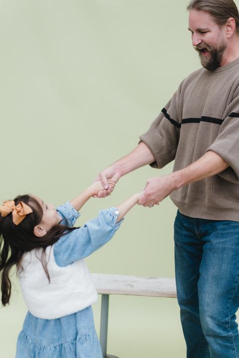 History Professor Stewart Davenport twirls his 4-year-old daughter, Shiloh, around.